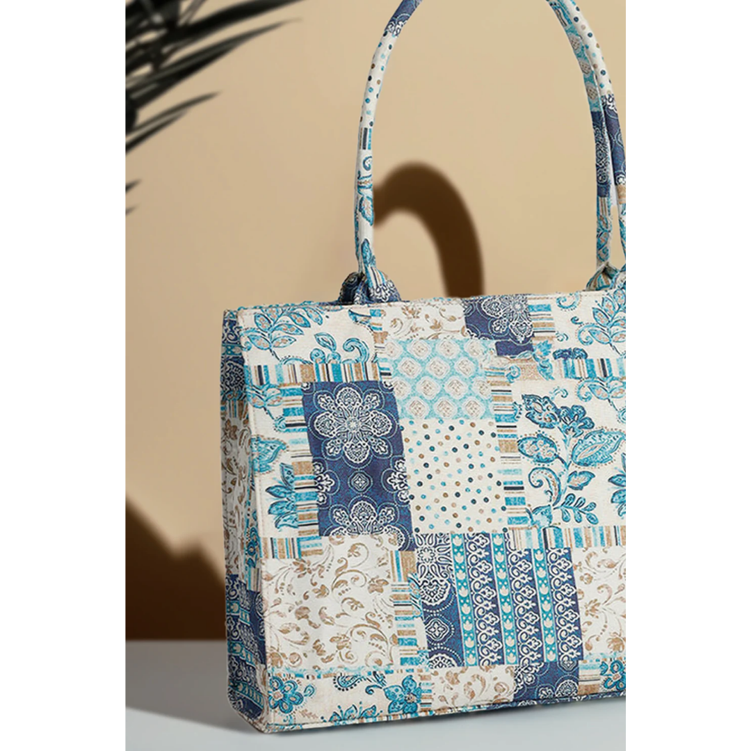 Bagwati artistic blue patchwork canvas handbag with floral and geometric patterns