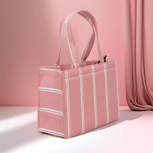 Bagwati pink mini canvas tote bag with white stripes, elegant design on pink background