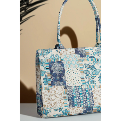 Bagwati artistic blue patchwork canvas handbag with floral and geometric patterns