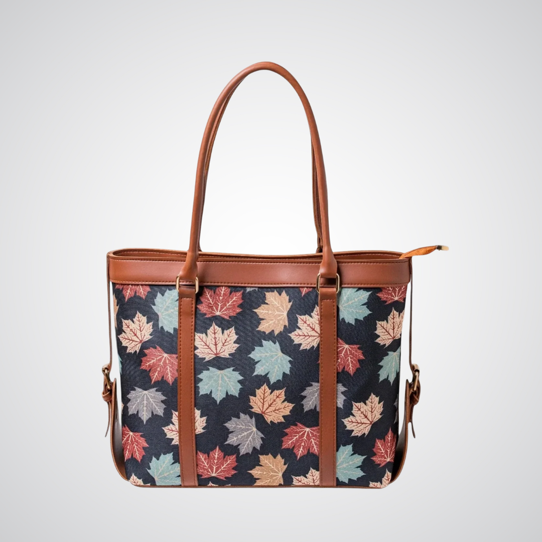Bagwati black canvas tote bag with autumn leaf print and brown leather straps