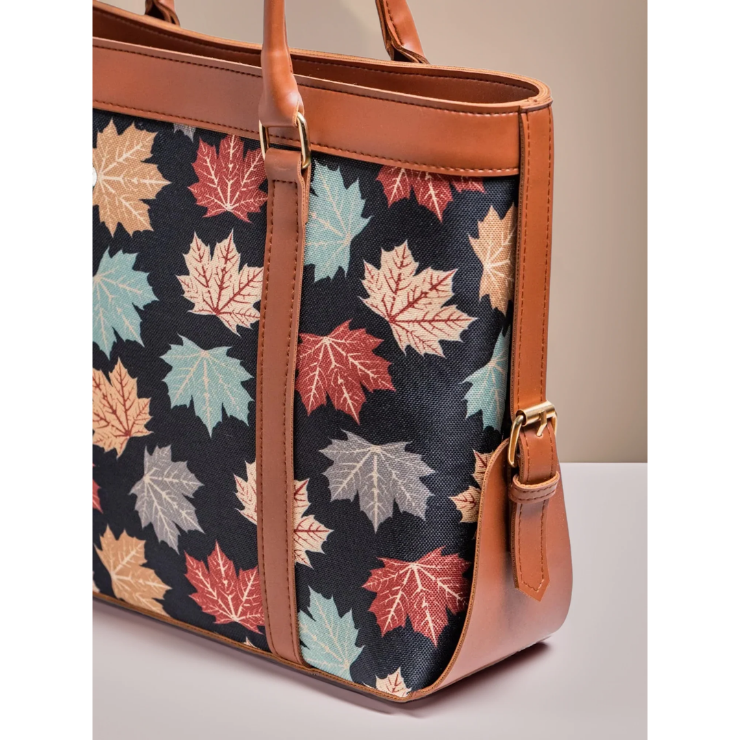 Bagwati black canvas tote bag with autumn leaf print and brown leather straps