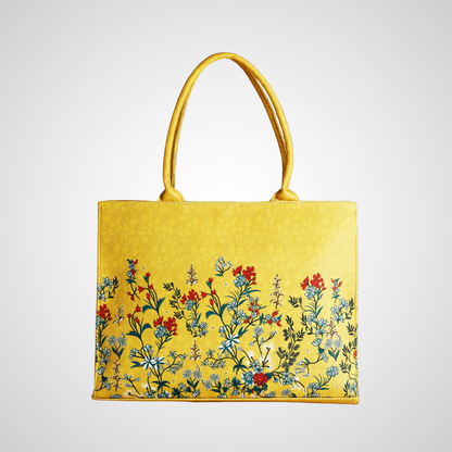 Bagwati yellow canvas tote bag with floral print, premium handbag on white background