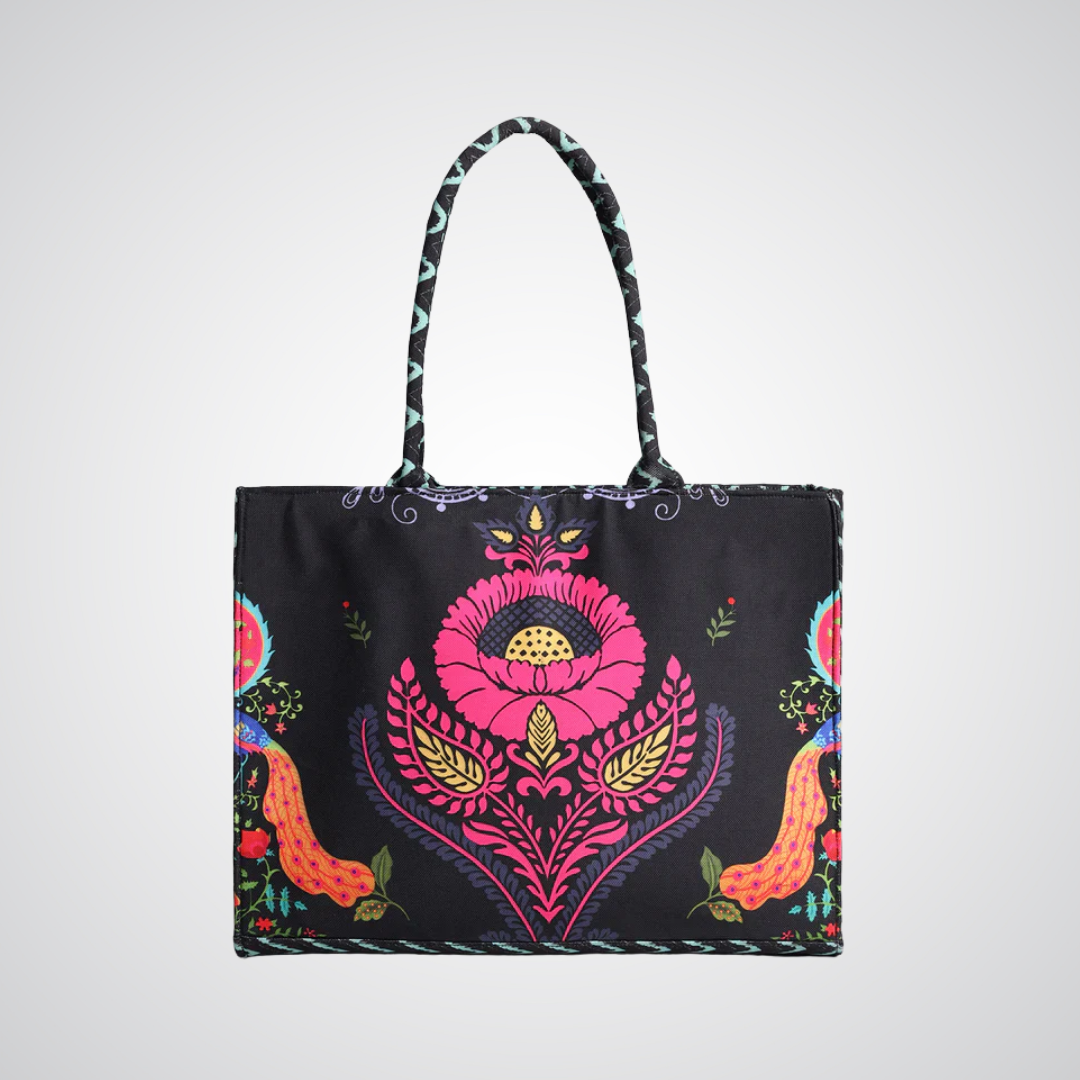 Bagwati Carnival Canvas Tote Bag in black with vibrant floral pattern and sturdy handles