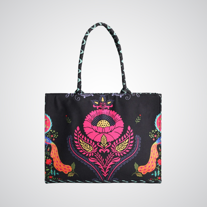 Bagwati Carnival Canvas Tote Bag in black with vibrant floral pattern and sturdy handles