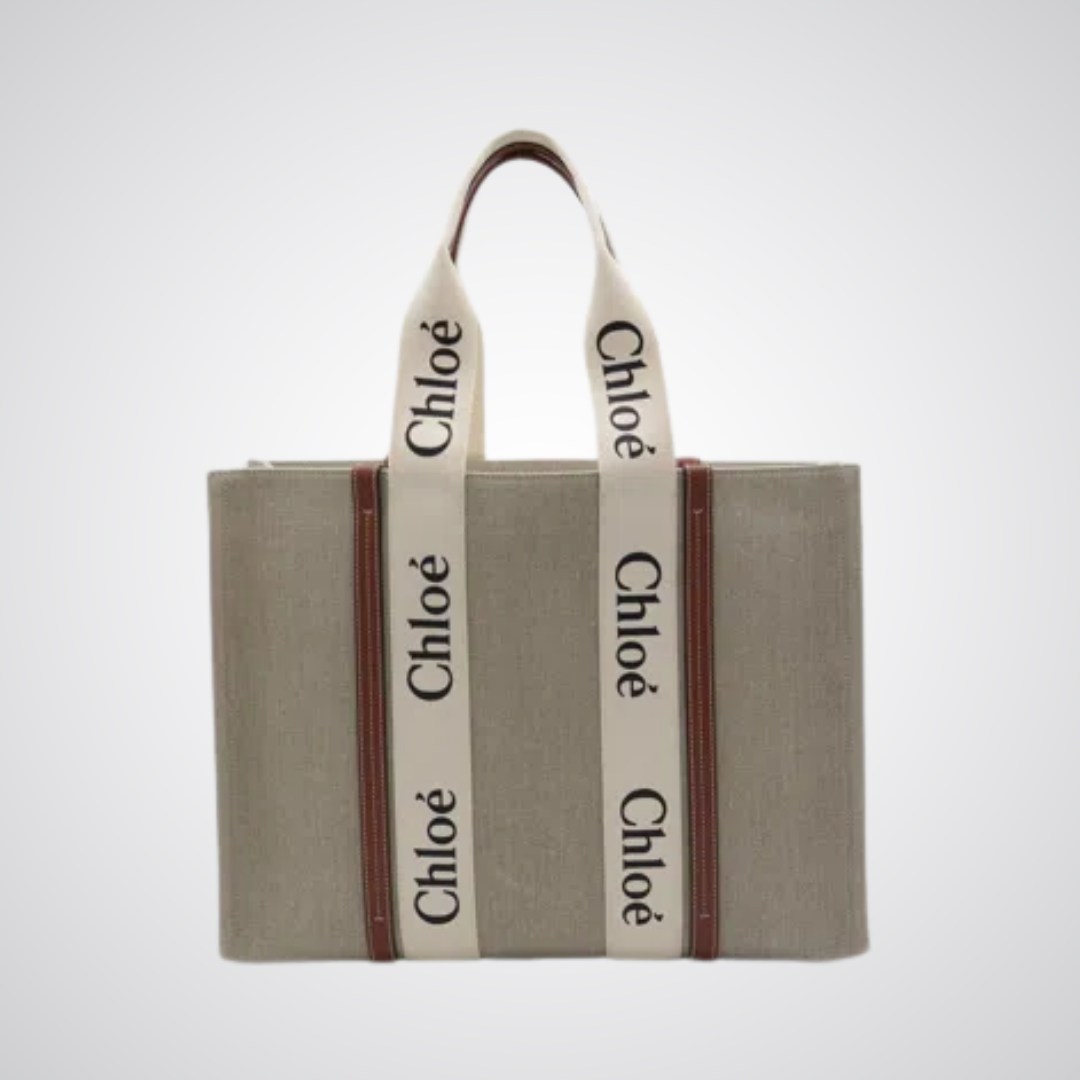 Grey canvas tote bag with white logo handles, premium handbag by Bagwati