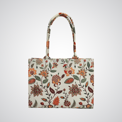Bagwati beige floral canvas tote bag with orange and green flower pattern on white background