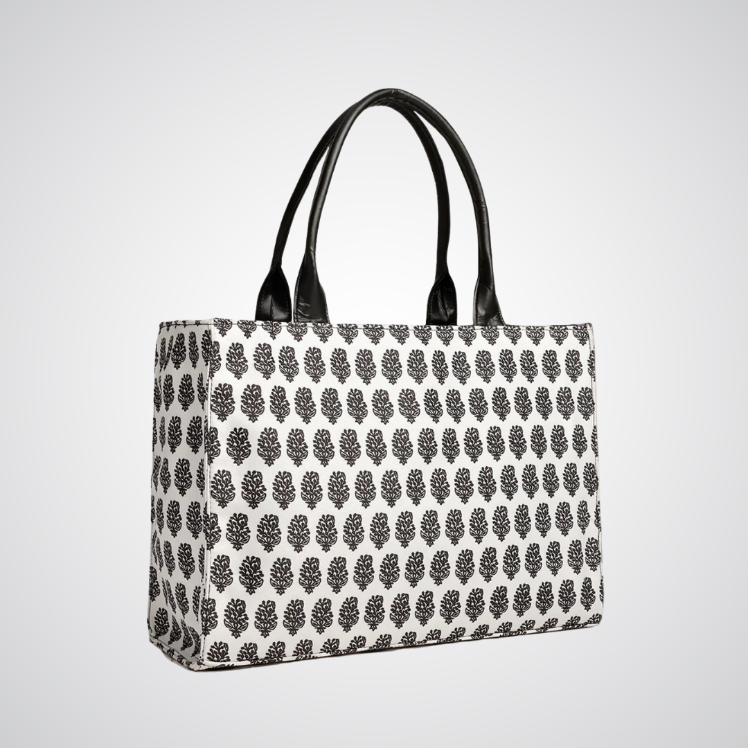 Bagwati monochrome canvas tote bag with black leaf print and black handles on white background