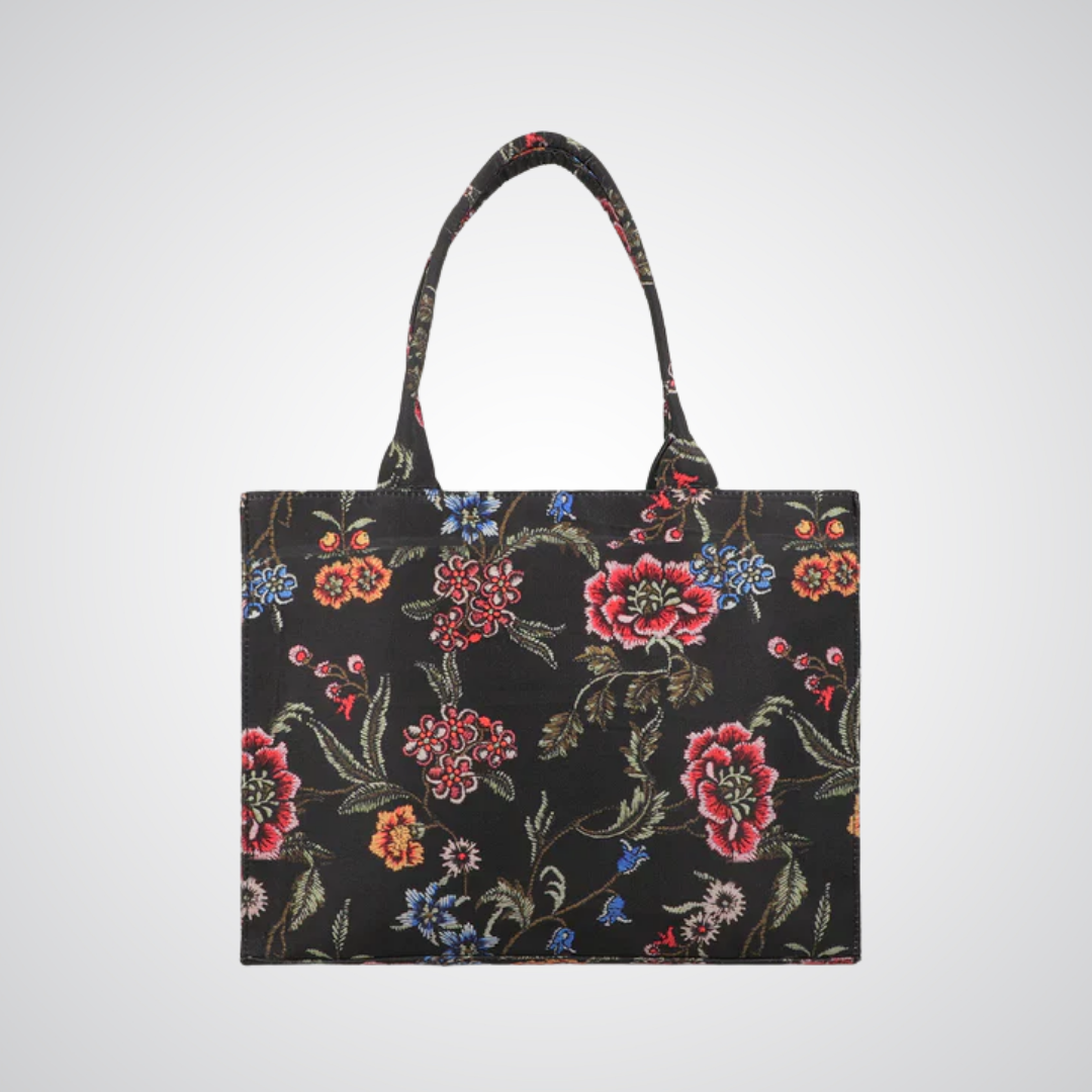 Bagwati black canvas tote bag with colorful floral pattern and shoulder straps
