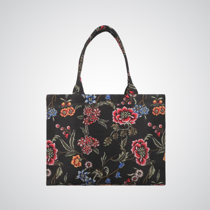 Bagwati black canvas tote bag with colorful floral pattern and shoulder straps