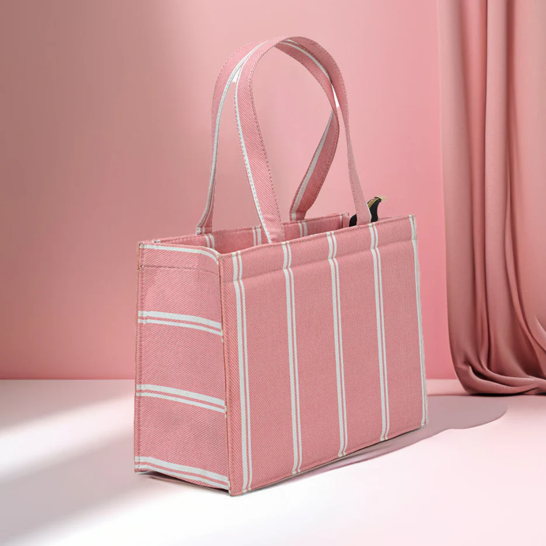 Bagwati pink mini canvas tote bag with white stripes, elegant design on pink background
