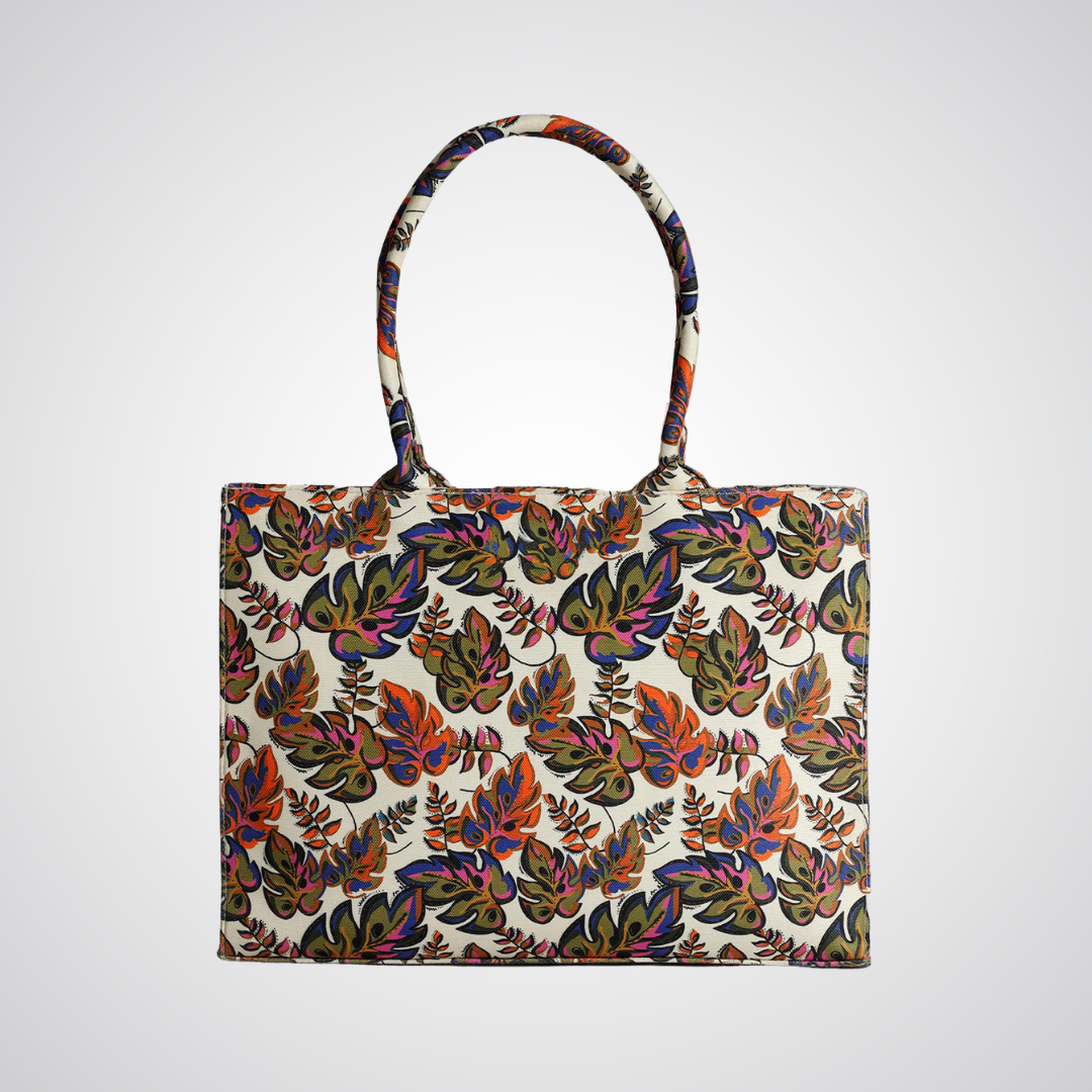 Bagwati beige canvas tote bag with colorful tropical leaf print, premium handbag design